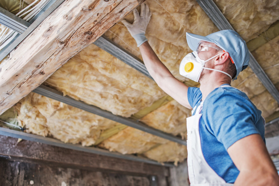 inspector inspecting attic roofing merrick ny